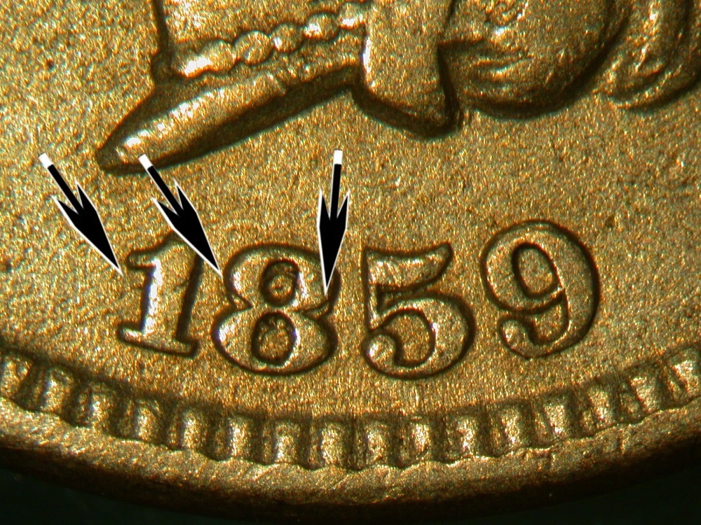 FS-302 Snow-2 Repunched Date on 1859 Indian Head cent showing secondary impressions in the 8 and 9 digit loops
